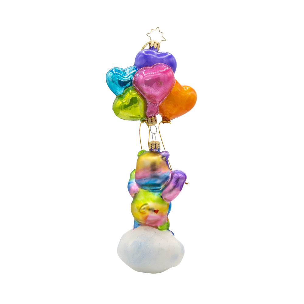 Togetherness Bear ornament. Featuring a rainbow-colored bear holding heart-shaped ballons atop a cloud. View of back.