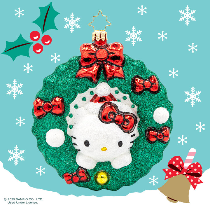 Hello Kitty's Holiday Wreath ornament. Hello Kitty wears her signature red bow nestled in a festive wreath adorned with red bows, holly, and sparkly accents. View of front. 