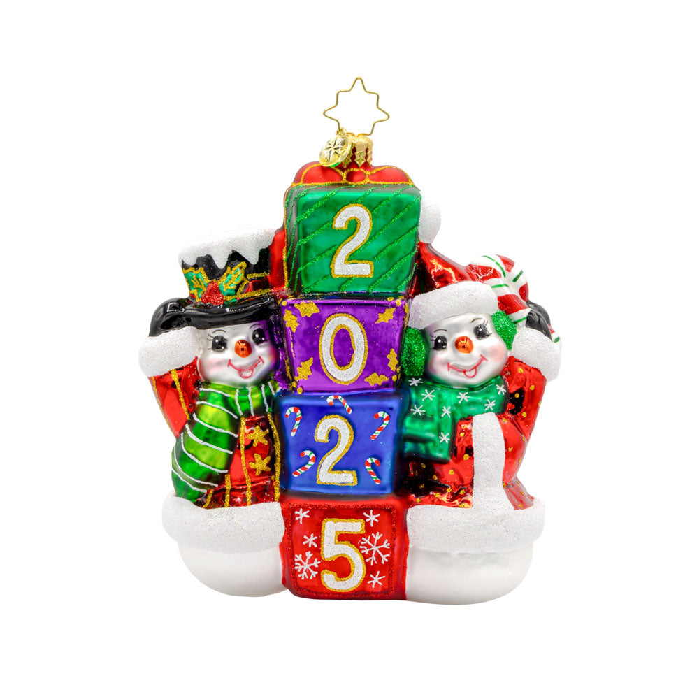 2025 Snowy Stackers ornament. These two snowmen are stacking up presents like building blocks. The gifts are dated with "2025." View of front.