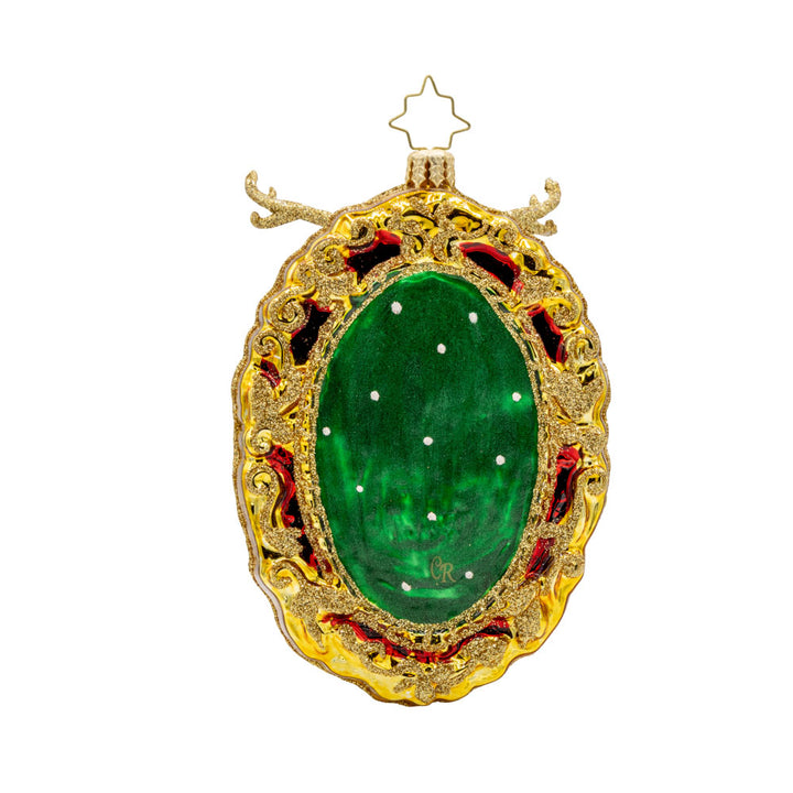 Mantle Majesty ornament. This deer and his shimmering antlers are centered within a golden frame. View of back.