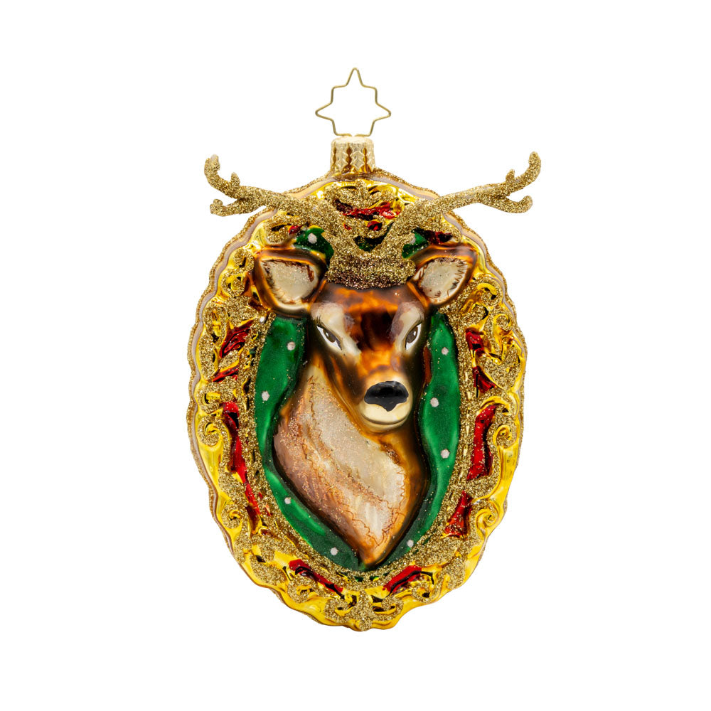 Mantle Majesty ornament. This deer and his shimmering antlers are centered within a golden frame. View of front.