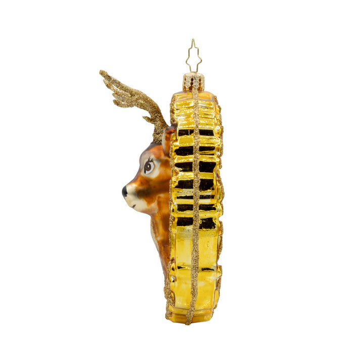 Mantle Majesty ornament. This deer and his shimmering antlers are centered within a golden frame. View of right side.
