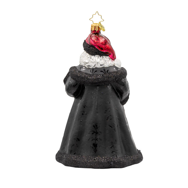 Bells of Christmas Santa ornament. Santa and his festive bell, dressed in a rich dark red gown with a shimmering pattern. View of back.