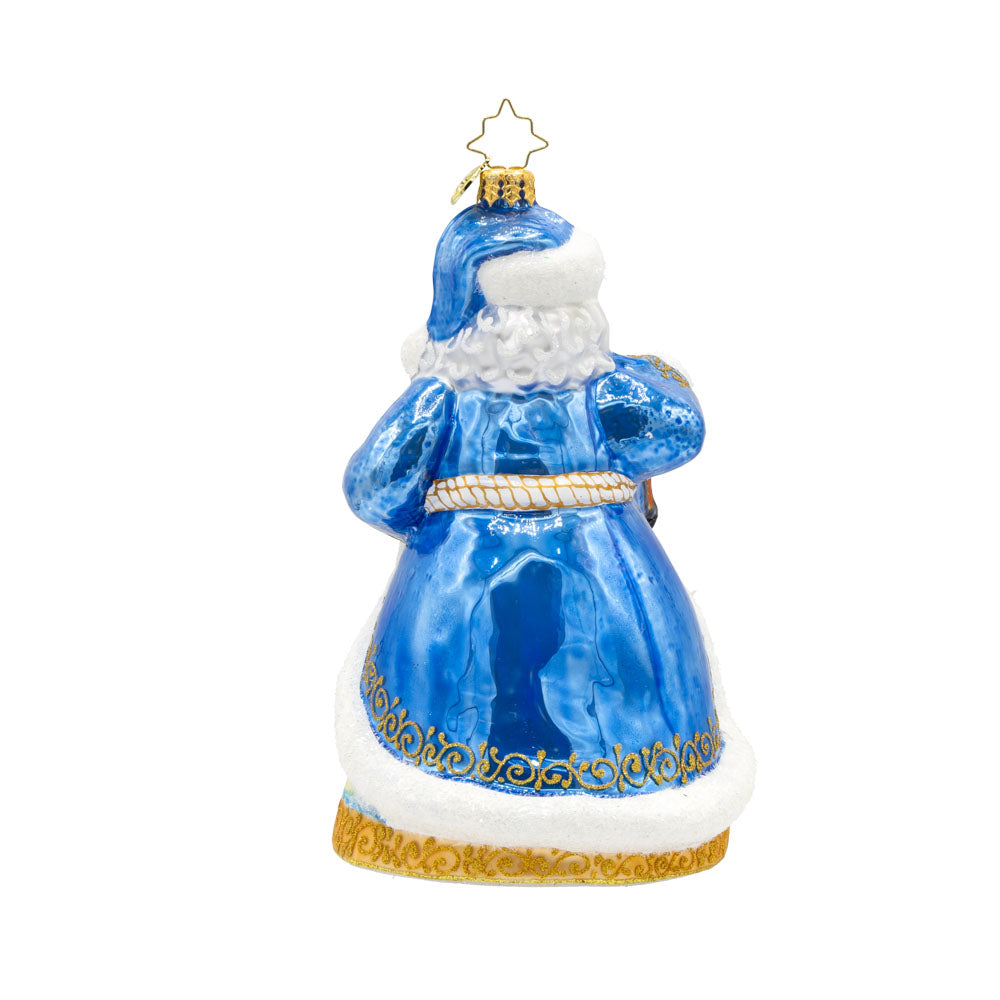 Coastal Claus ornament. Santa dons a blue robe with hand painted lighthouse scene. View of back.