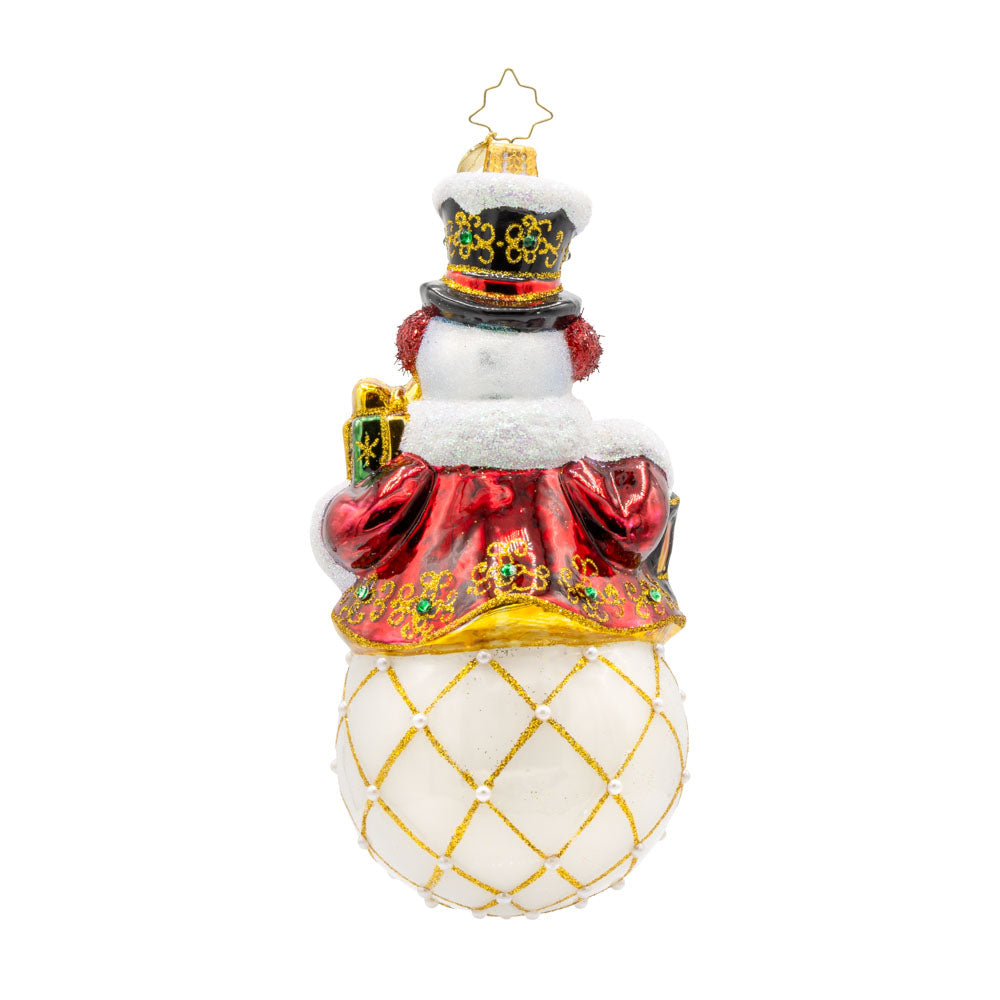 Radiant Reflections Snowman ornament. This snowman is adorned with shimmering glitter, sparkling gems, and a festive red lantern. With his reflective base, this ornament catches the light beautifully. View of back.