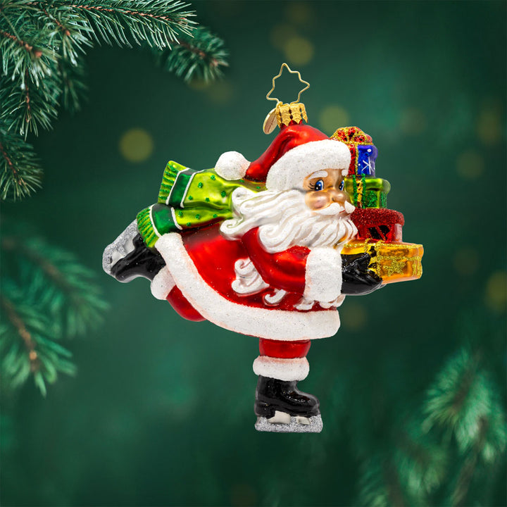 Dashing Through The Ice ornament. Santa is seen ice skating with a stack of gifts in hand. View of front. 