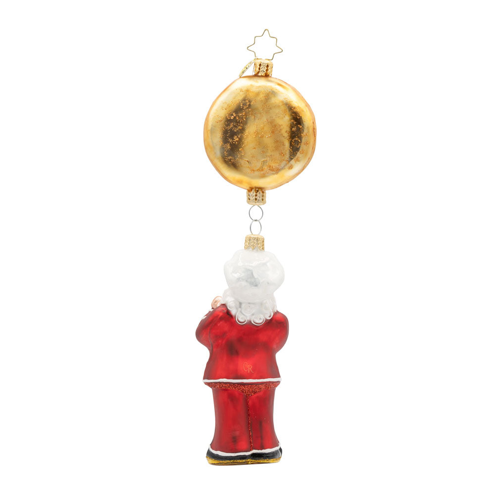 St. Nick's Pizza Delight ornament. Santa in a red chef's outfit dangles from a large pepperoni pizza pie. View of back.