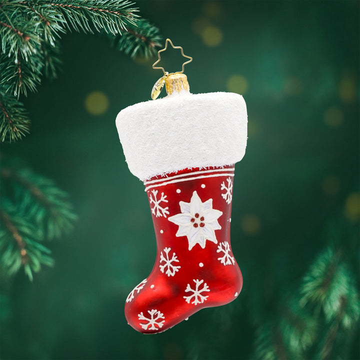 Wish Upon A Stocking ornament. This stocking is adorned with shimmering snowflakes and a poinsettia. View of front. 