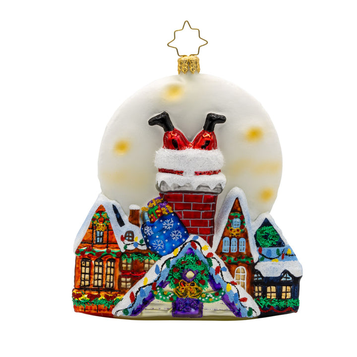 Santa's Moonlight Mischief ornament. Santa goes headfirst down a chimney a set a scene of festive homes lit by a large moon. View of back.