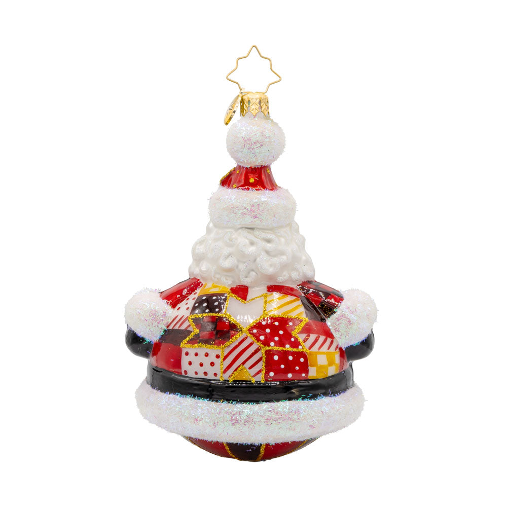 Quilted Jolly Claus ornament. Santa is dressed in a cozy patchwork quilt with shiny buttons and a festive hat. View of back.