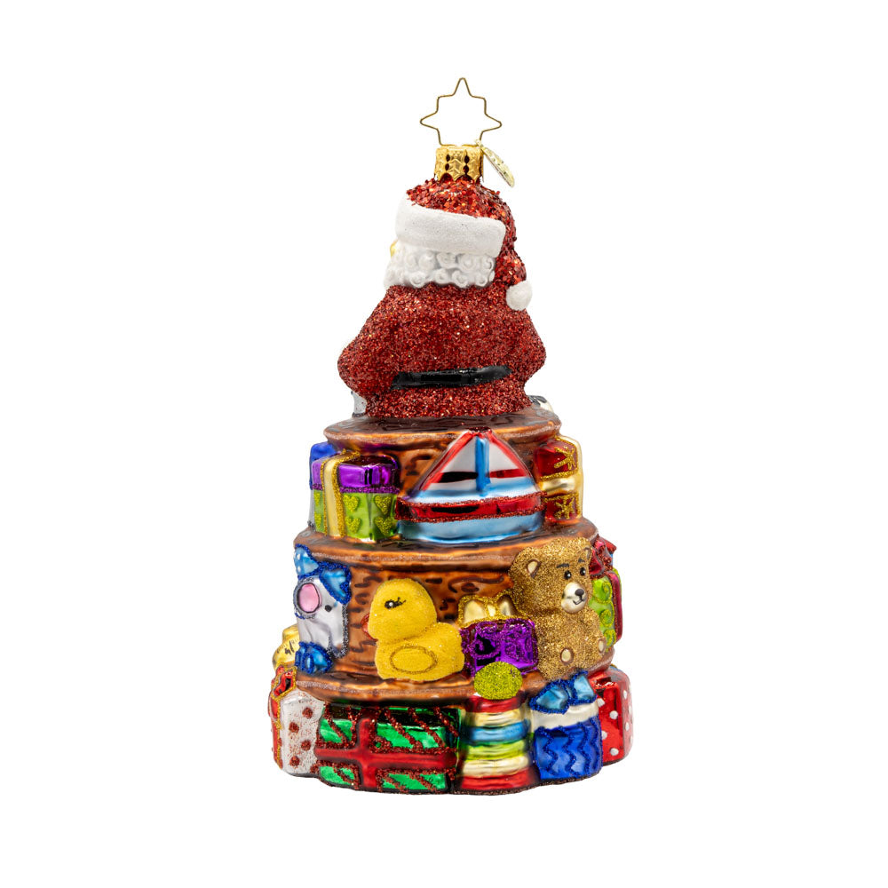 NorthPole Workshop Ornament. Santa atop a pile of toys. View of back.
