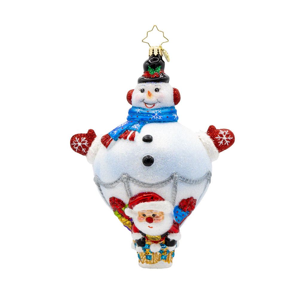 Up, Up, and Snowy ornament. This charming piece features a friendly snowman hot-air balloon, and a jolly Santa Claus ready to embark on a festive flight. View of front.