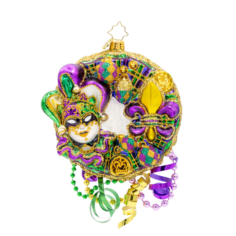 Mardi Gras Majesty ornament. This festive Mardi Gras wreath features vibrant colors, intricate details, and playful elements. View of front. 