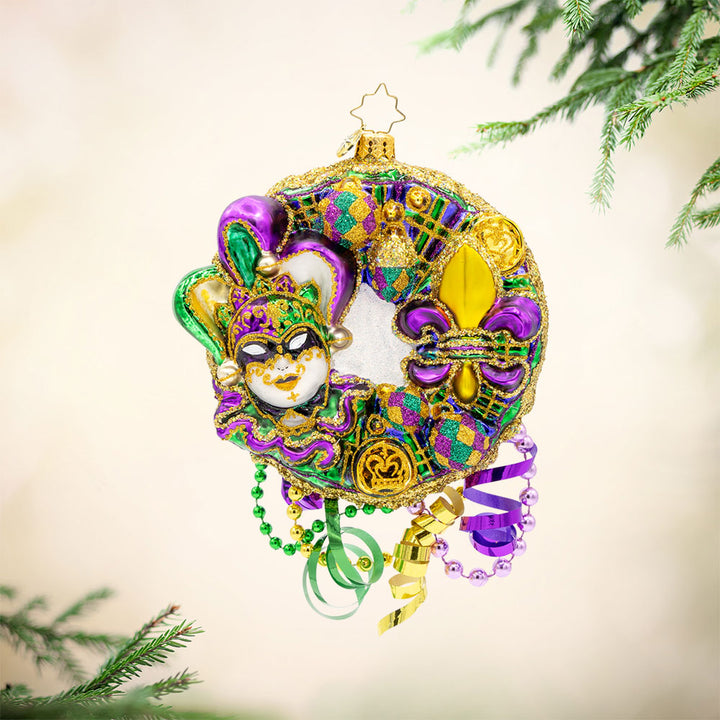 Mardi Gras Majesty ornament. This festive Mardi Gras wreath features vibrant colors, intricate details, and playful elements. View of front. 