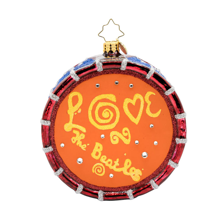 Magical Mystery Tour Drum ornament. Featuring the Beatles iconic "Magical Mystery Tour" logo and a shimmering drumhead. "Love The Beatles" design on back. View of back.