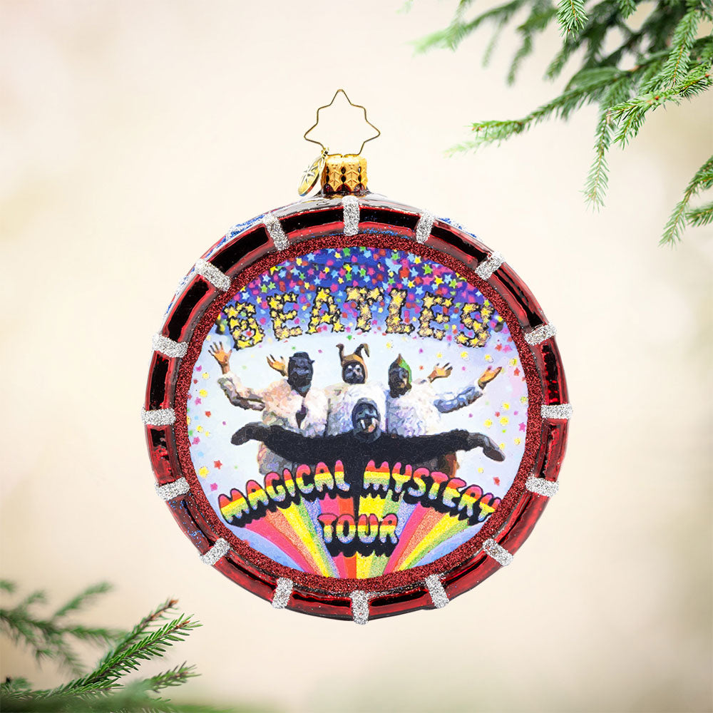 Magical Mystery Tour Drum ornament. Featuring the Beatles iconic "Magical Mystery Tour" logo and a shimmering drumhead. View of front. 