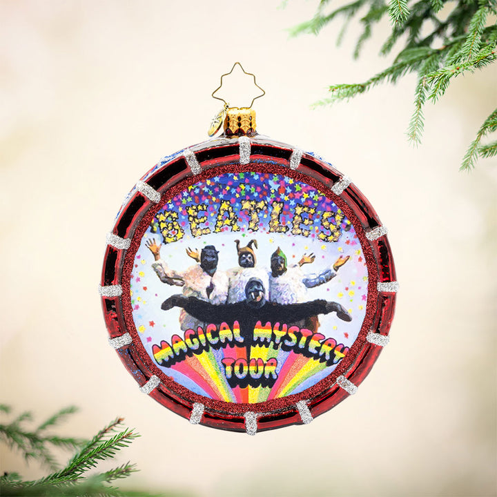 Magical Mystery Tour Drum ornament. Featuring the Beatles iconic "Magical Mystery Tour" logo and a shimmering drumhead. View of front. 