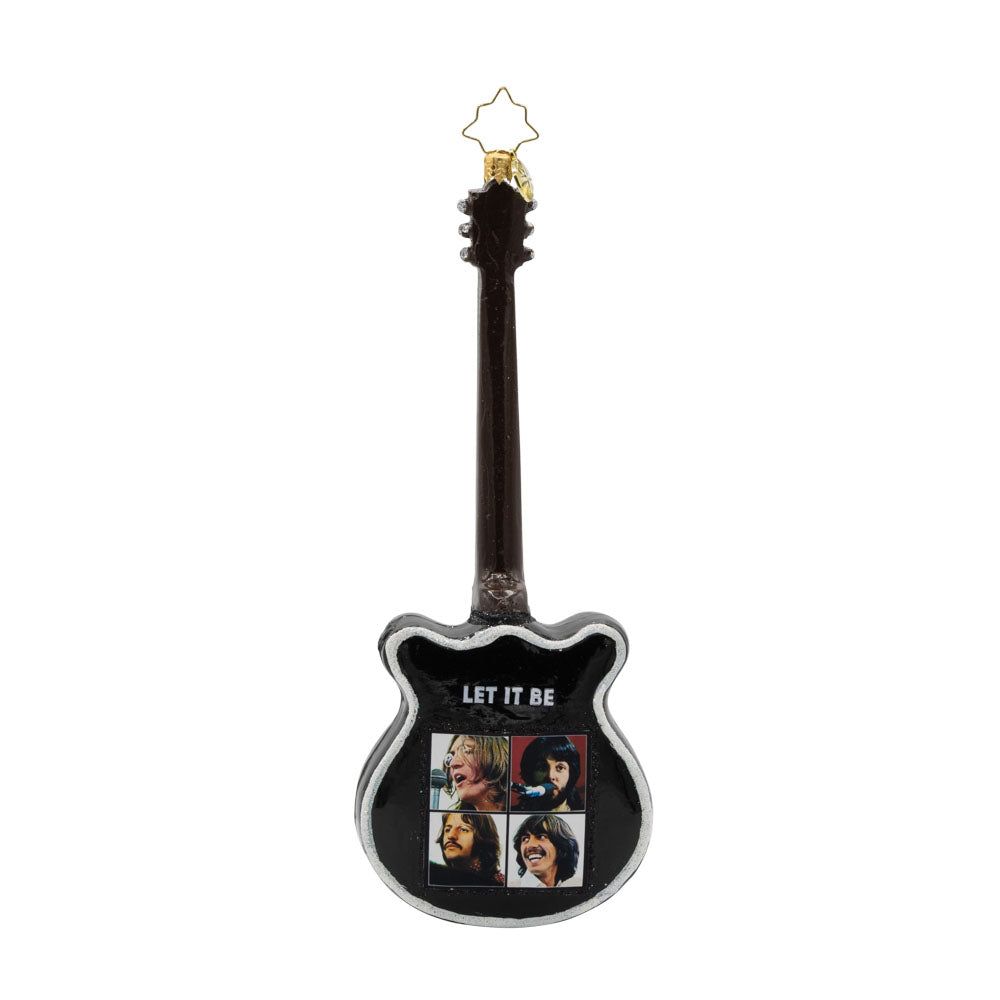 Let it Be Guitar ornament. Featuring the famous "Let It Be" song title on a black and white guitar. "Let It Be" written on back with photo of all four Beatles. View of back. 