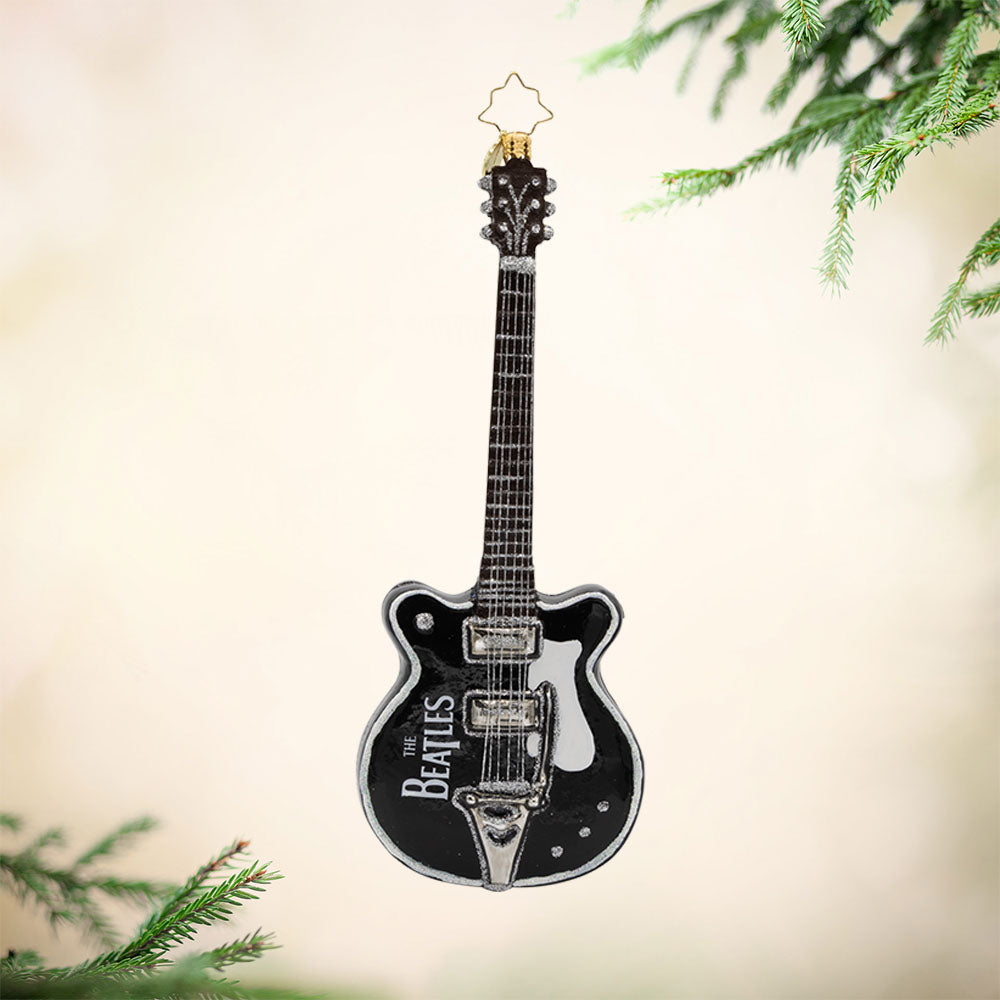Let it Be Guitar ornament. Featuring the famous "Let It Be" song title on a black and white guitar. View of front. 