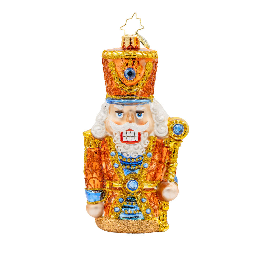 Gilded Guardian ornament. This nutcracker is donned in all gold with blue accents. View of front. 