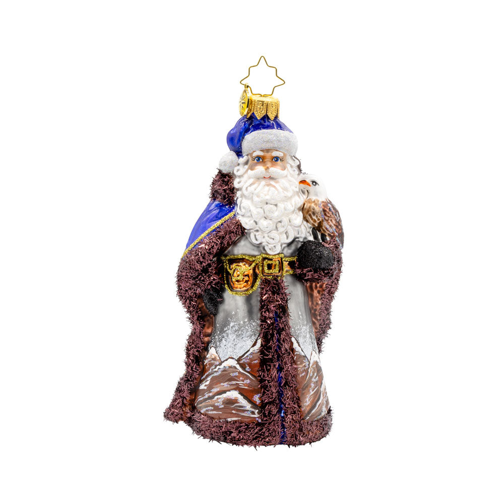 Mountain Majesty St. Nick ornament.  Santa’s dons a hand-painted mountain-scene coat with an eagle by his side. View of front. 