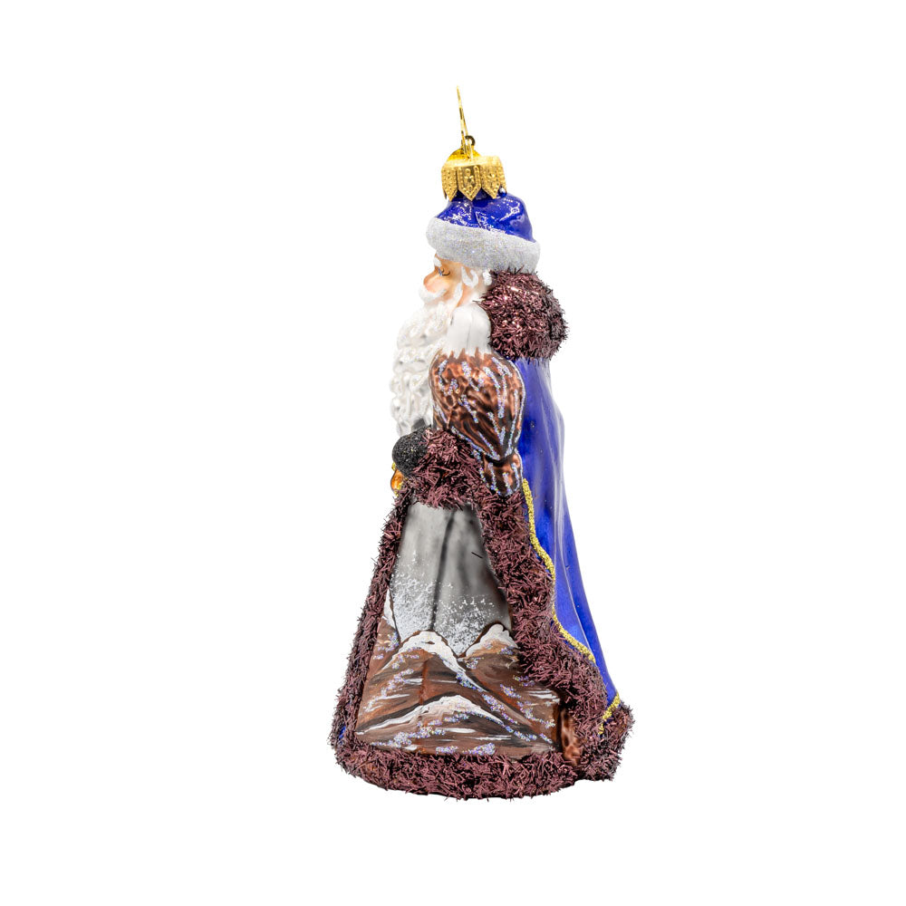 Mountain Majesty St. Nick ornament.  Santa’s dons a hand-painted mountain-scene coat with an eagle by his side. View of right side.