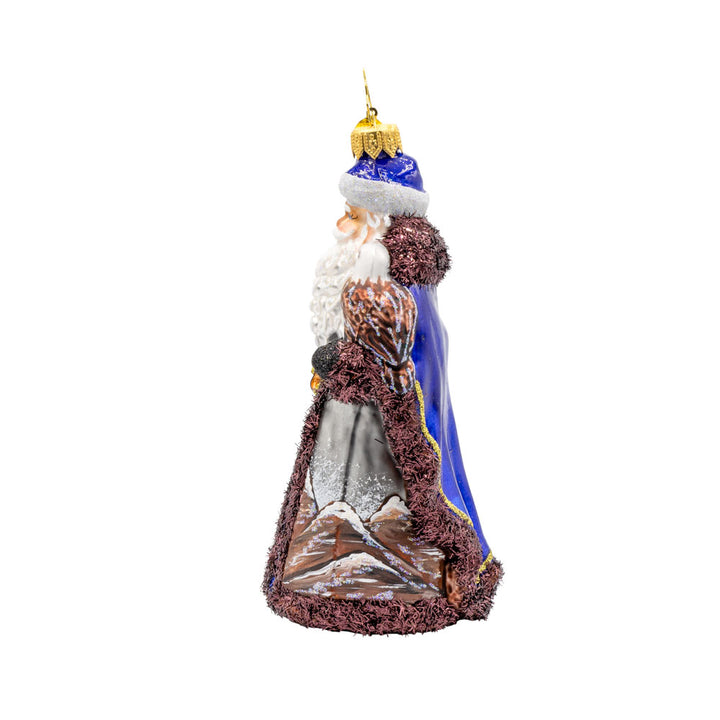 Mountain Majesty St. Nick ornament.  Santa’s dons a hand-painted mountain-scene coat with an eagle by his side. View of right side.