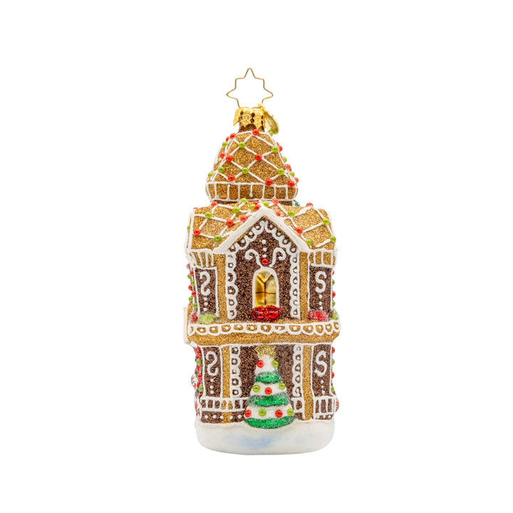 Gingerbread Manor ornament. With candy details and frosting accents on this gingerbread house. View of side.