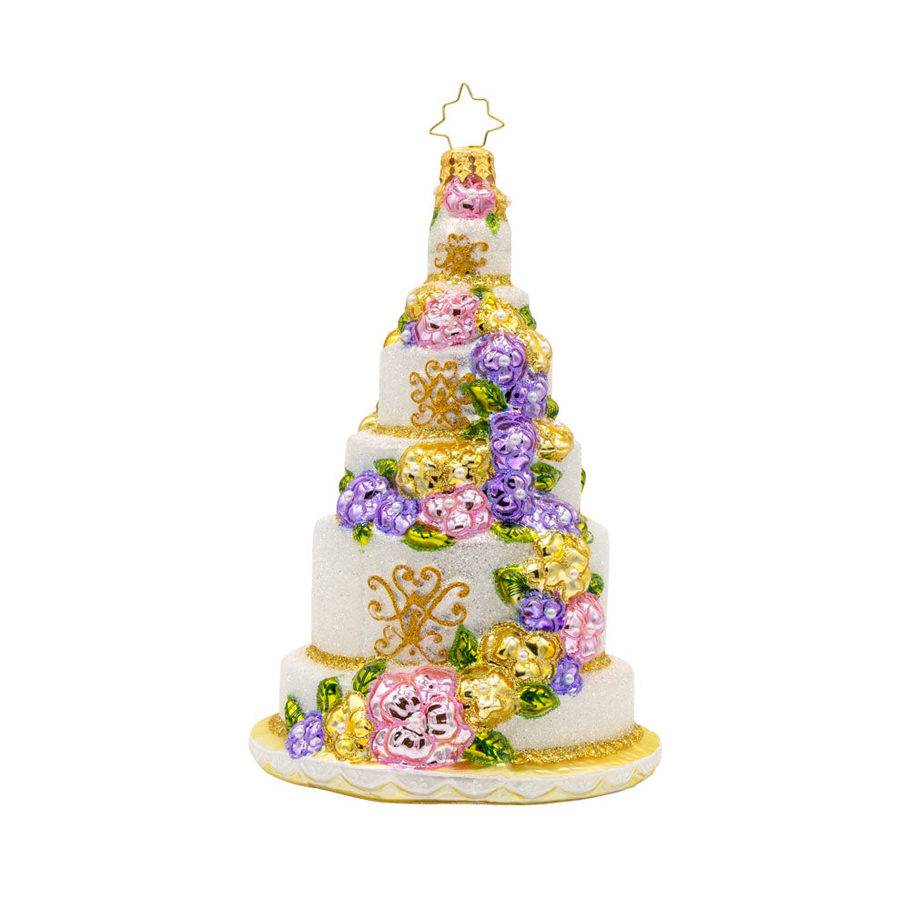 A Taste of Love ornament. An elegant wedding cake with an array of flowers and intricate designs. View of back.