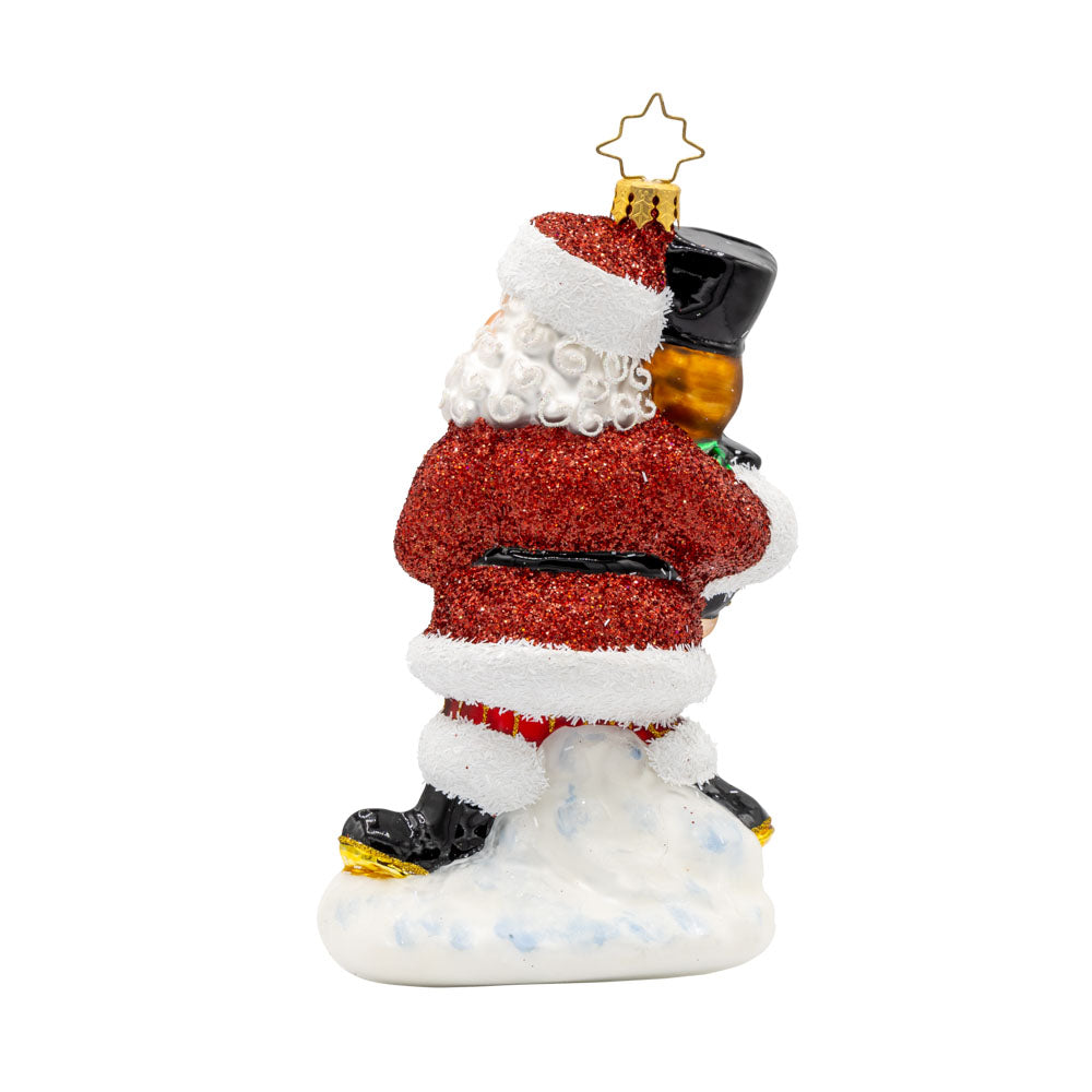 The Christmas Guardian ornament. Santa has a life-size nutcracker in vibrant colors of green, black, purples, and gold. View of back.