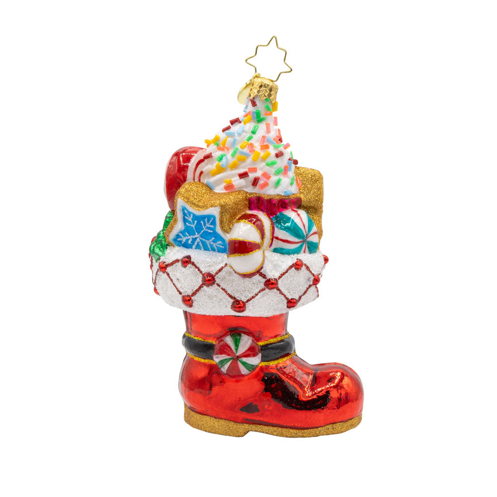 Candy Cane Kick ornament. Features Santa’s classic red boot, brimming with sweet treats. View of front. 