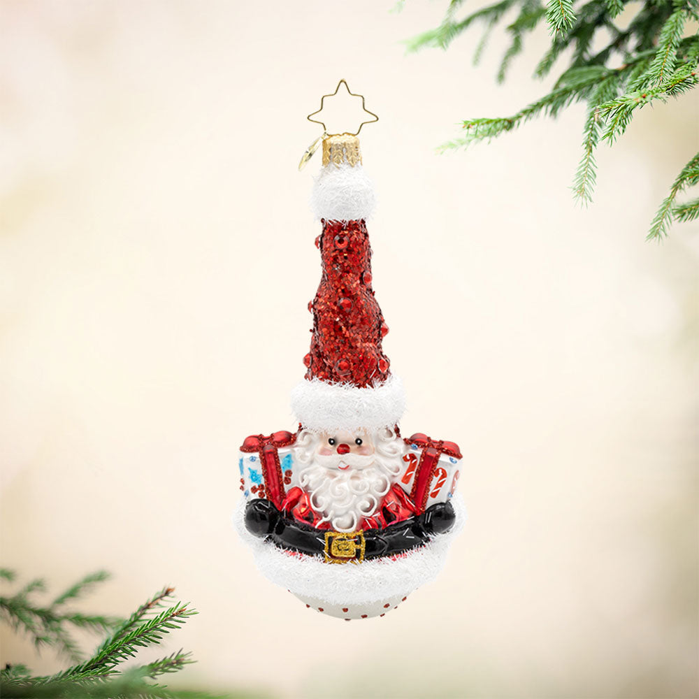 Twisty Holiday Duo ornament. Santa and his snowman friend, dressed in their festive attire, with gifts in hand. Santa is on the front. The snowman is on the back. View of front. 