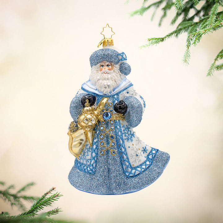 Ivory Frost Santa ornament. Santa's draped in luxurious ivory tones and sparkling frost. View of front. 