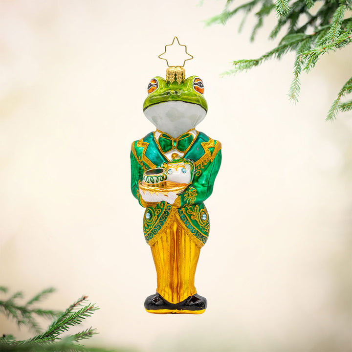 Hoppy Hospitality ornament. A dapper frog butler in a green and gold tailcoat. View of front. 