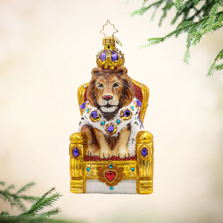 Regal Lion Majesty Ornament. A regal lion sits upon a throne. View of front. 