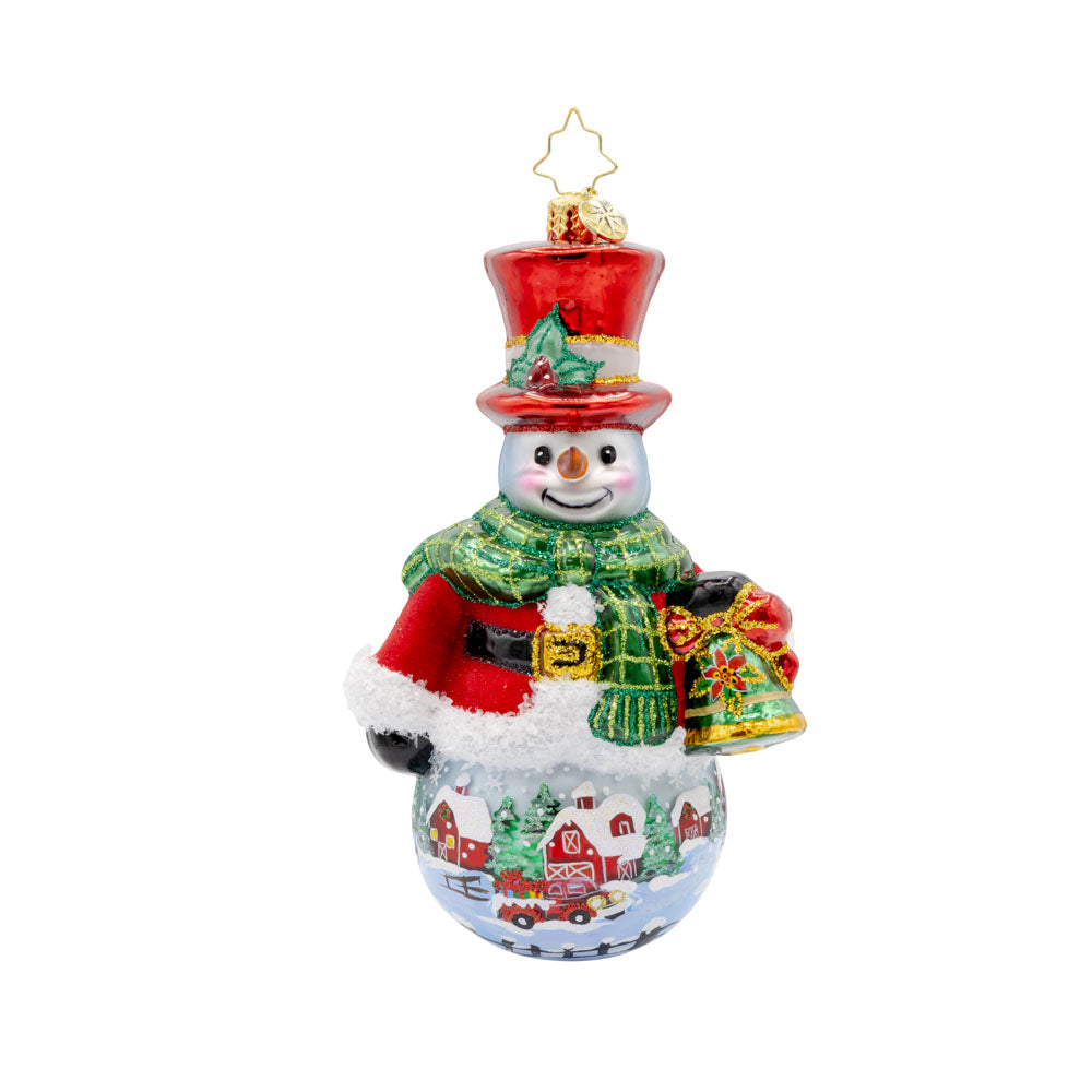 Snowy Sentinel ornament. From his shiny hat and pulled nose to his cozy scarf and festive bell. The hand-painted scene adds a touch of winter magic to this delightful ornament. View of front.