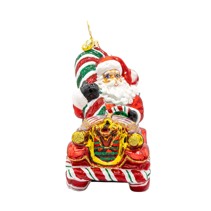 Sweet Ride Cruiser ornament. Santa drives his candy-themed car. View of left side.