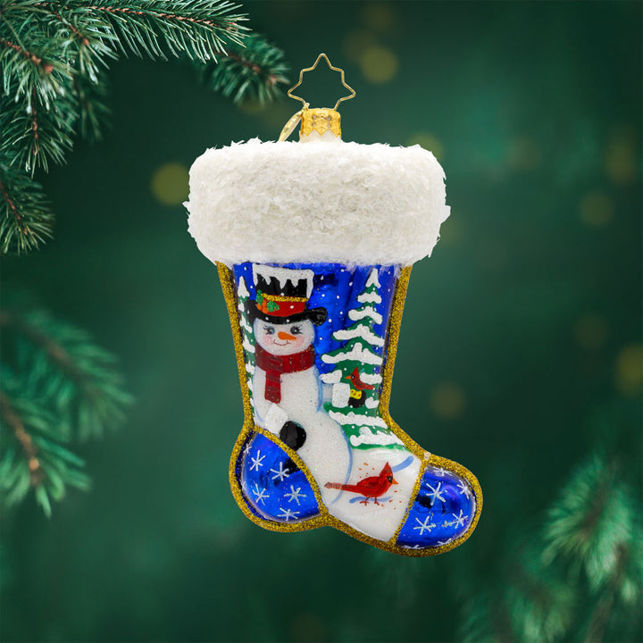 Winter Wishes Stocking ornament. This stocking is adorned with shimmering snowflakes, a jolly snowman, and a festive cardinal. View of front.