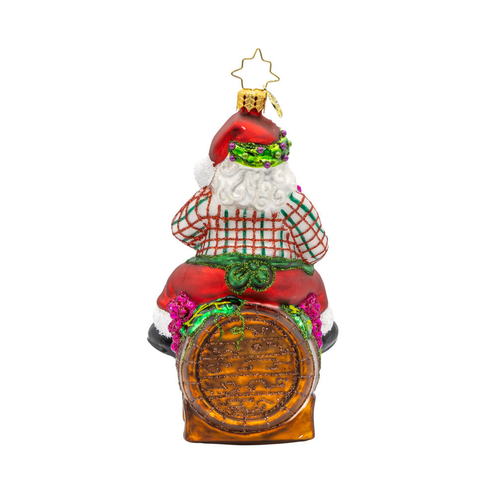 I Believe in Wine Santa ornament. Santa enjoys a glass of wine perched on a barrel. View of back.