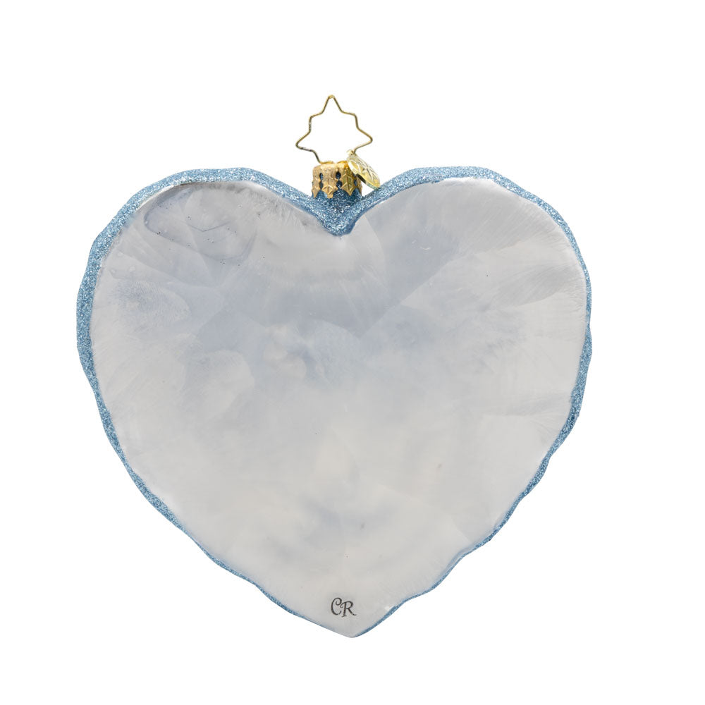 Puffin Lovin' Pair ornament. Two puffins perched on a heart-shaped ice sculpture. Flat white color on back. View of back.