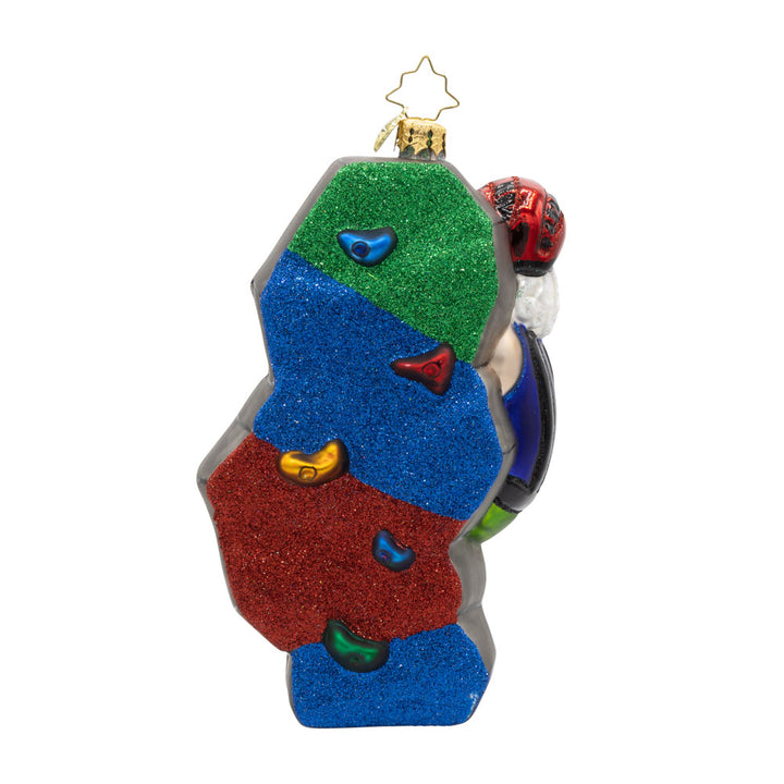 Climbin' Claus ornament. Santa scales colorful climbing holds clad in his climbing gear. View of back.