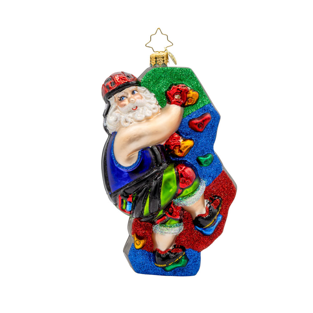 Climbin' Claus ornament. Santa scales colorful climbing holds clad in his climbing gear. View of front.