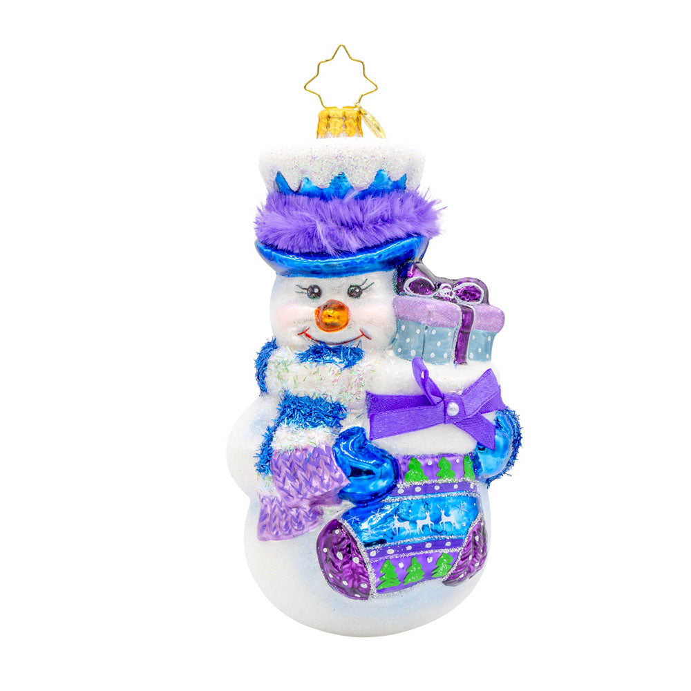 Snowy Stocking Surprise ornament. This snowman features an oversized stocking in festive colors of blue and purple. View of front. 