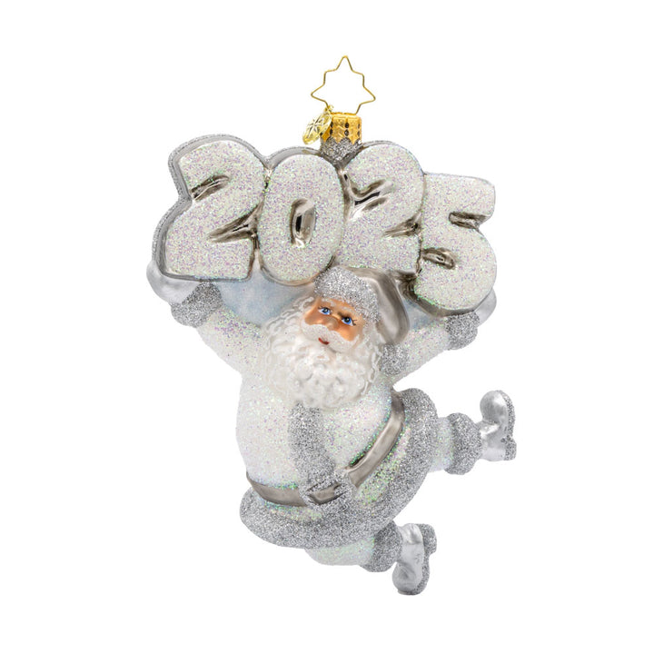 Oh, Shiny Night Ornament! Santa is shining bright, ready to spread holiday cheer. Dressed in a shimmering silver suit and a sparkling hat. "2025" is held above his head in similar colors. View of front. 