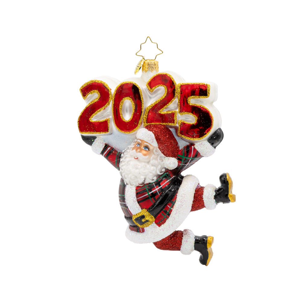 Tartan Time For Fun Ornament. Santa is dressed in a plaid suit, complete with a shiny hat, mittens, and a touch of glitter. "2025" is held above his head in similar colors. View of front. 
