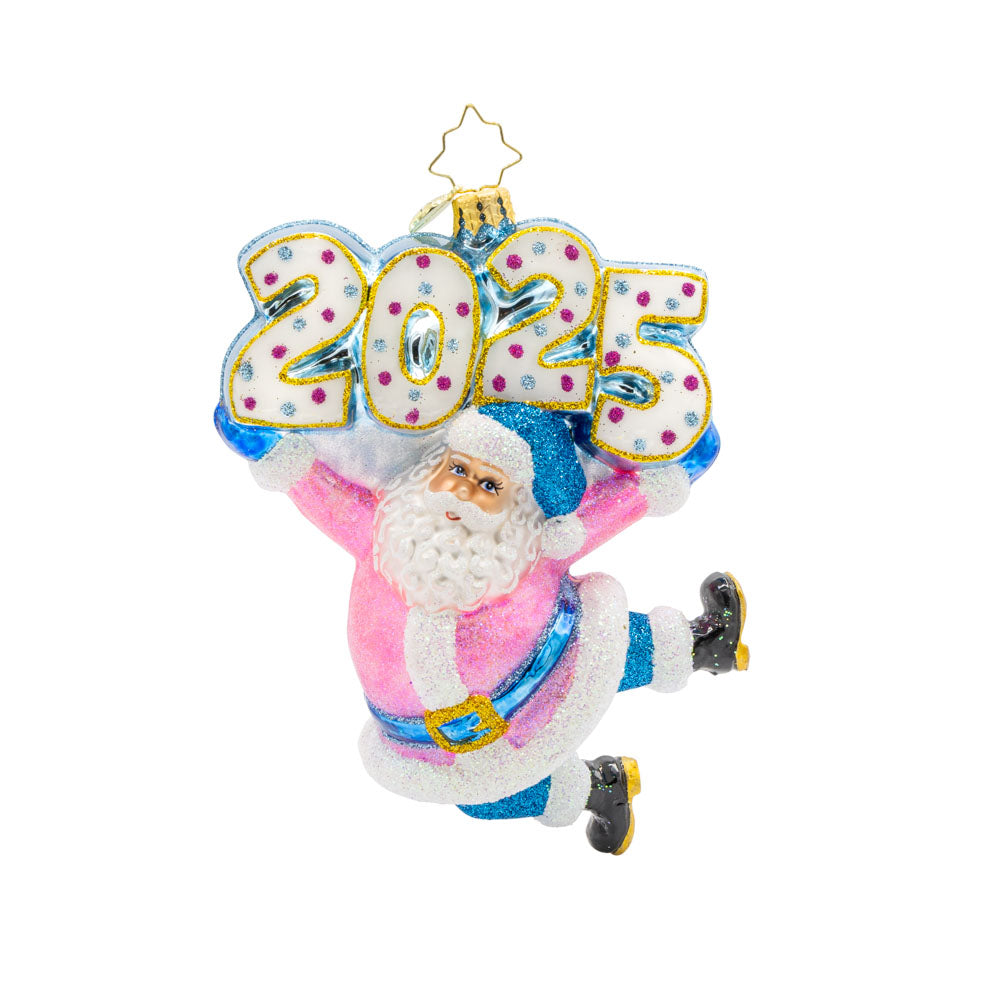 Jingle Bell Jamboree Ornament. Santa's rocking a dazzling outfit with glittering accents and a splash of pink. "2025" is held above his head in similar colors. View of front. 