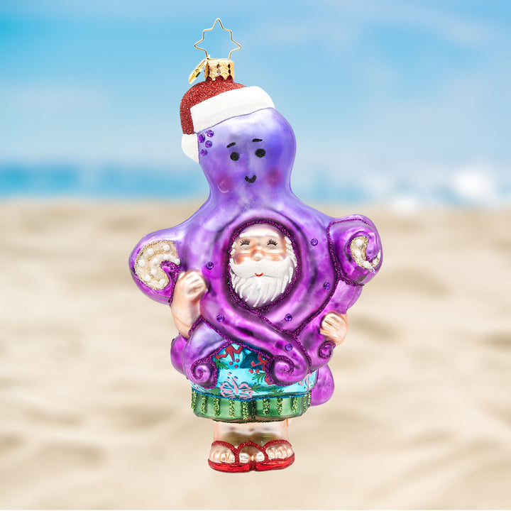 The Christmas Catch. Purple octopus ornament hugging Santa. View of front