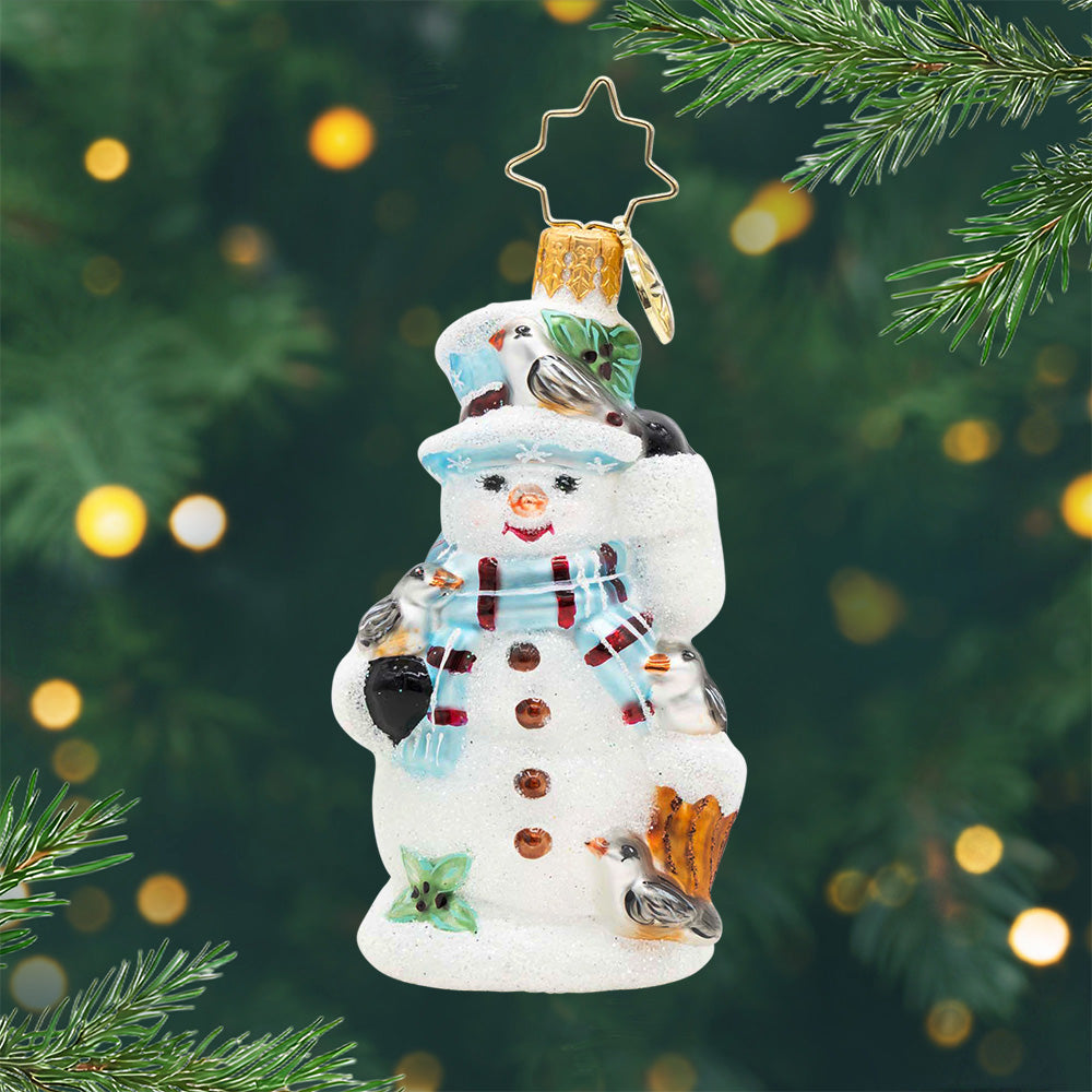 Snowy Perch Pals Gem. Snowman ornament in light blue scarf and matching hat and four silver birds on the snowman. View of front