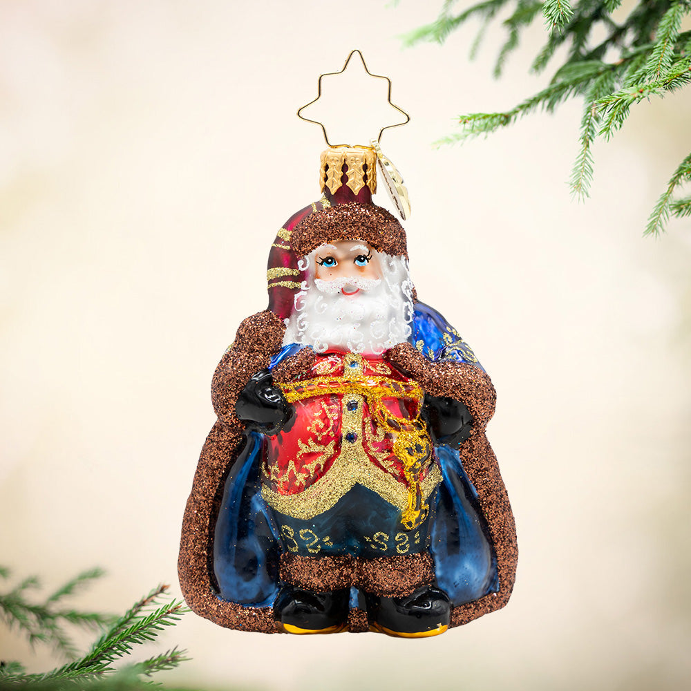 Keymaster Klaus Gem. Santa ornament of him in a blue rob with brown sparkly trim and a red, al with gold detailing. View of front
