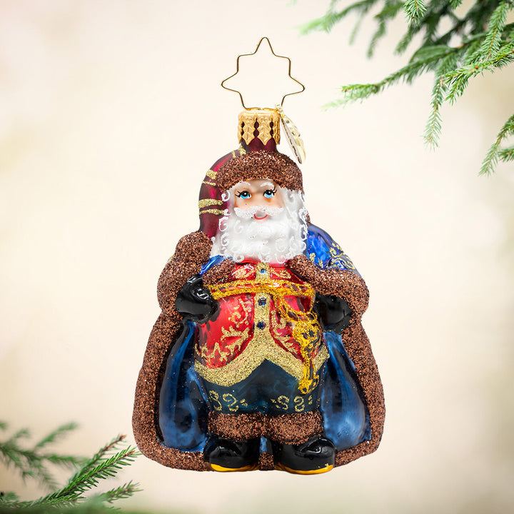Keymaster Klaus Gem. Santa ornament of him in a blue rob with brown sparkly trim and a red, al with gold detailing. View of front